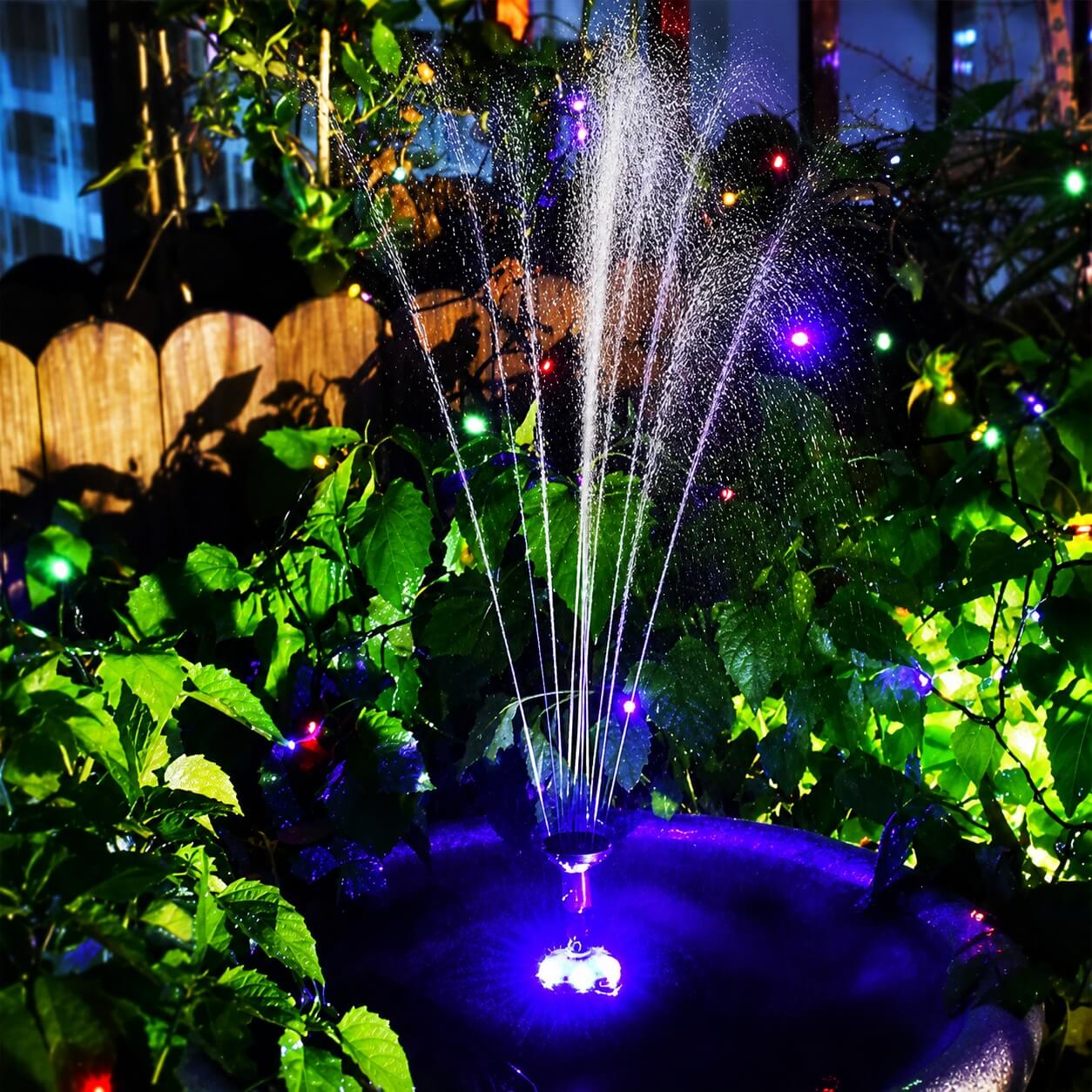 Fantana arteziana cu leduri 2000 l/h 6 Fantana arteziana cu leduri functionand noaptea intr-un decor de gradina