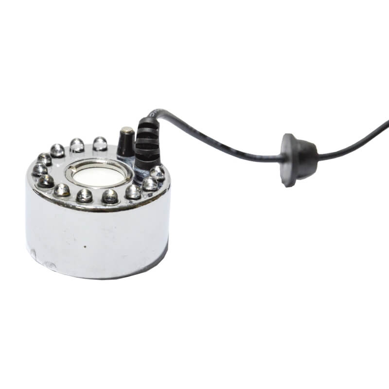Generator de ceata cu 12 leduri 3 Generator de ceata cu 12 leduri este un Mist Maker ce simuleaza nori mici si ceata racoroasa. Generator de ceata cu ultrasunete, aparat ceata rece ce functioneaza in orice vas de apa (castroane de apa, cascade, etc), cu o adancime de minim 5 cm! Generator de ceata ce ridica deasupra apei nori de ceata si totodata creeaza un spectacol de lumini in apa – Genereaza o ceata racoroasa. Ideal pentru cresterea nivelului de umiditate si crearea unui mediu cetos natural si umed. Impreuna cu aceasta tehnologie, iluminarea cu leduri creaza o ambianta aparte. Functioneaza in orice vas de apa (castroane de apa, cascade, etc), cu o adancime de minim 5 cm! Sistemul de siguranta a dispozitivului nu permite functionarea acestuia (dispozitivul se opreste automat) in cazul in care nivelul apei scade sub 5 mm deasupra senzorului. • Aparat ceata rece ce creste nivelul de umiditate a aerului de pana la 100%. • Efect vizual deosebit. • Simuleaza nori mici si ceata in terarii tropicale. • Genereaza roua dimineata in terariile desertice. • Ledurile au capacitatea de a-si schimba automat culorile dand nastere unui spectacol unic in combinatie cu ceata generata. Generatorul de ceata ultrasonic este un dispozitiv sigur, eficient si numai cu efecte benefice pentru crearea unui mediu cat mai aproape de conditiile naturale in care traiesc reptilele. Acest generator de ceata cu ultrasunete poate fi folosit de asemenea in orice incapere ca umidificator sau in scop pur si simplu decorativ. Dispozitivul utilizeaza cca 80ml apa/ora, la o temperatura de lucru de temperatura de lucru 5 °C – 40 °C. Silentios: difuzorul de ceata prin tehnologia ultrasonica silentioasa iti va respecta linistea. Specialitatea lui este de a creea o atmosfera relaxanta. Dimensiuni – 38 mm inaltime x 44 mm diametru