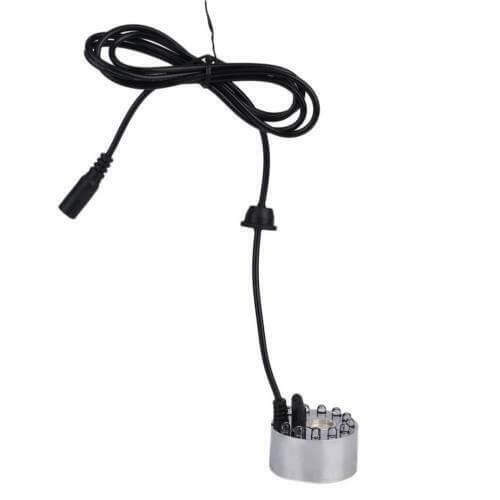 Generator de ceata cu 12 leduri 11 Generator de ceata cu 12 leduri este un Mist Maker ce simuleaza nori mici si ceata racoroasa. Generator de ceata cu ultrasunete, aparat ceata rece ce functioneaza in orice vas de apa (castroane de apa, cascade, etc), cu o adancime de minim 5 cm! Generator de ceata ce ridica deasupra apei nori de ceata si totodata creeaza un spectacol de lumini in apa – Genereaza o ceata racoroasa. Ideal pentru cresterea nivelului de umiditate si crearea unui mediu cetos natural si umed. Impreuna cu aceasta tehnologie, iluminarea cu leduri creaza o ambianta aparte. Functioneaza in orice vas de apa (castroane de apa, cascade, etc), cu o adancime de minim 5 cm! Sistemul de siguranta a dispozitivului nu permite functionarea acestuia (dispozitivul se opreste automat) in cazul in care nivelul apei scade sub 5 mm deasupra senzorului. • Aparat ceata rece ce creste nivelul de umiditate a aerului de pana la 100%. • Efect vizual deosebit. • Simuleaza nori mici si ceata in terarii tropicale. • Genereaza roua dimineata in terariile desertice. • Ledurile au capacitatea de a-si schimba automat culorile dand nastere unui spectacol unic in combinatie cu ceata generata. Generatorul de ceata ultrasonic este un dispozitiv sigur, eficient si numai cu efecte benefice pentru crearea unui mediu cat mai aproape de conditiile naturale in care traiesc reptilele. Acest generator de ceata cu ultrasunete poate fi folosit de asemenea in orice incapere ca umidificator sau in scop pur si simplu decorativ. Dispozitivul utilizeaza cca 80ml apa/ora, la o temperatura de lucru de temperatura de lucru 5 °C – 40 °C. Silentios: difuzorul de ceata prin tehnologia ultrasonica silentioasa iti va respecta linistea. Specialitatea lui este de a creea o atmosfera relaxanta. Dimensiuni – 38 mm inaltime x 44 mm diametru